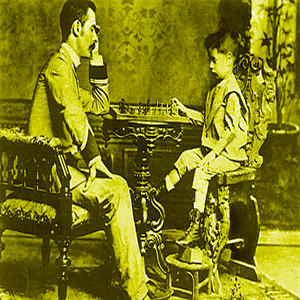 A very young Jose Raul Capablanca tries conclusions with his father